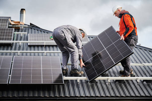 Solar panel installation team at work on a roof